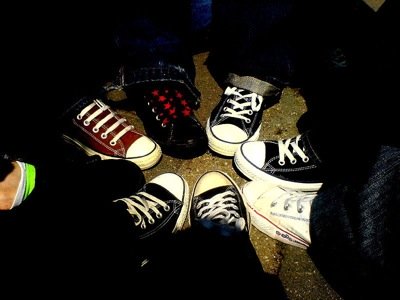 A circle of converse shoes. Photo by mickey van der stap.
